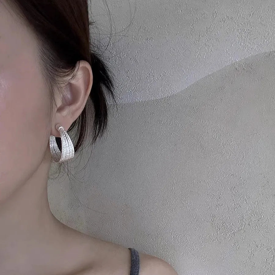 Multi-layer geometric bracelet earrings in gold and silver colour options as studs and clips