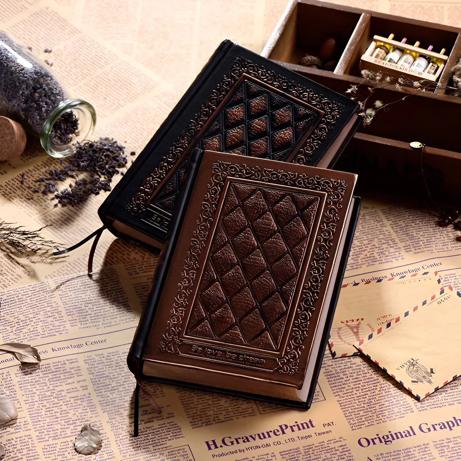 Embossed faux leather notebook in bronze colour, open to show thick white pages.
