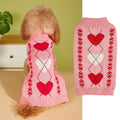 Red and pink dog sweater with love heart and bow design on a small dog.