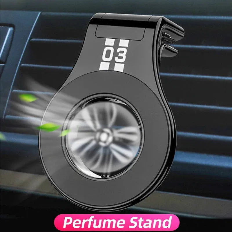 Black magnetic car air vent phone holder with adjustable clip and perfume slice attached