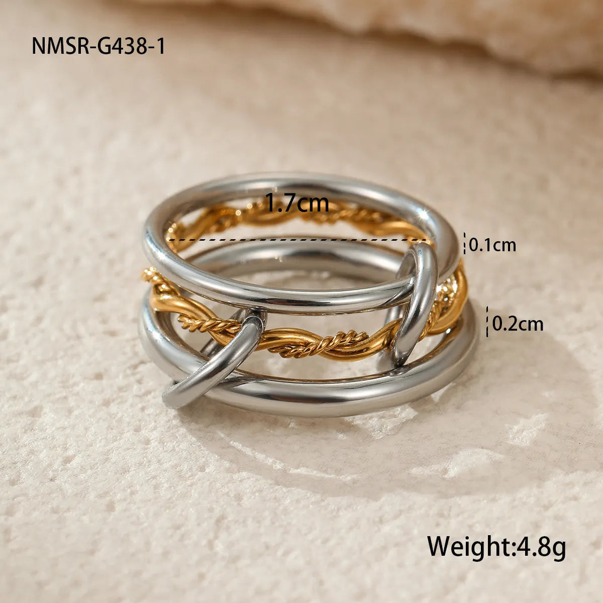 Stacked colour matching stainless steel ring set with 18K gold plating and exaggerated profile