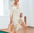 Apricot coloured women's crochet patchwork midi dress with half sleeves on a hanger.
