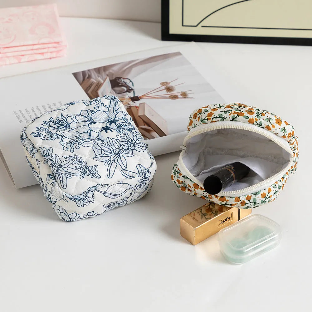 Floral polyester key storage bag with sewing thread detailing in multiple colour patterns