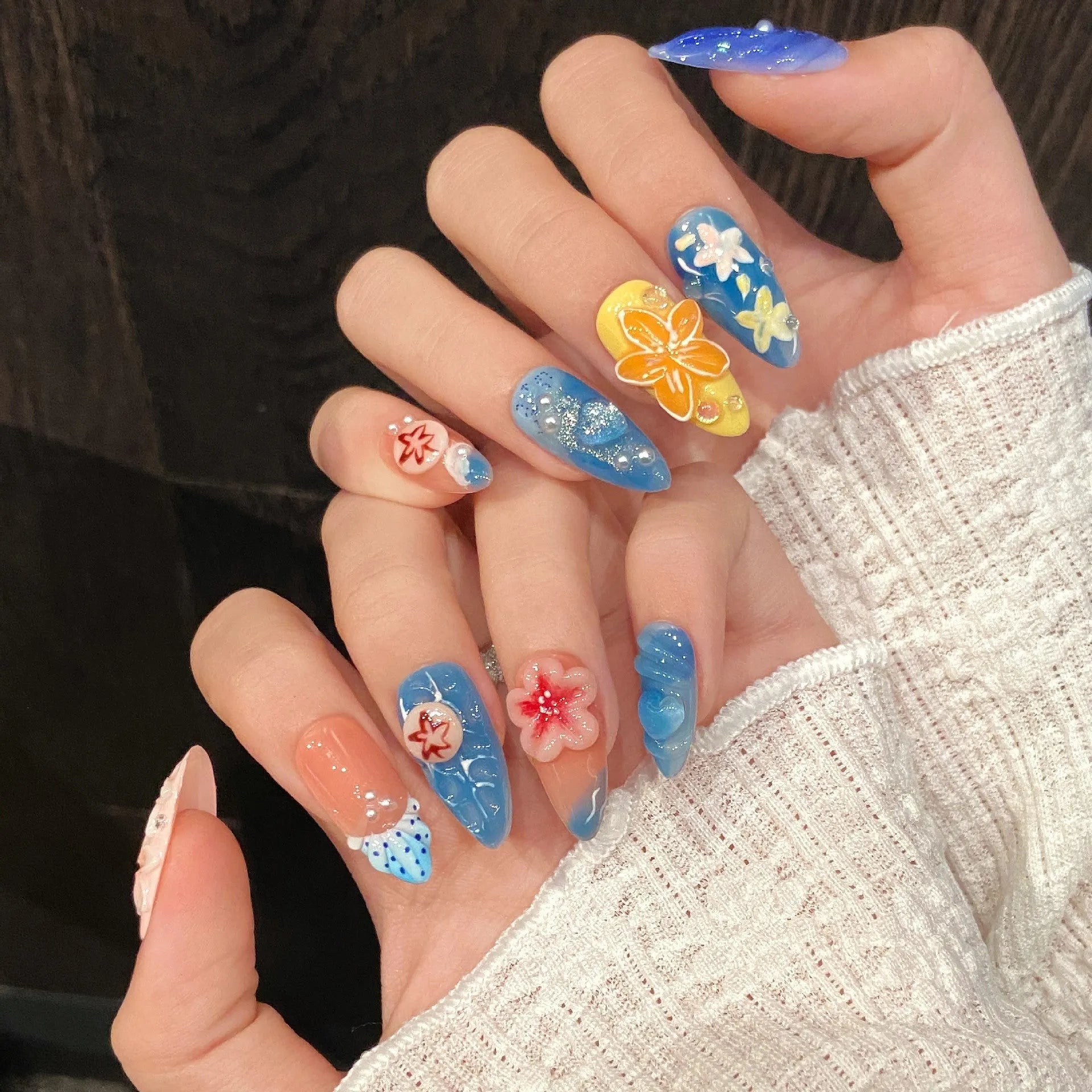 Plastic wearable armour with three-dimensional carved jellyfish marine design in almond nail colour