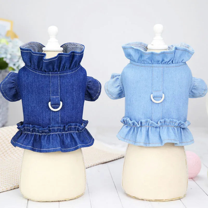 Blue denim dog dress vest with ruffles and a metal leash hook on the back for small dogs.