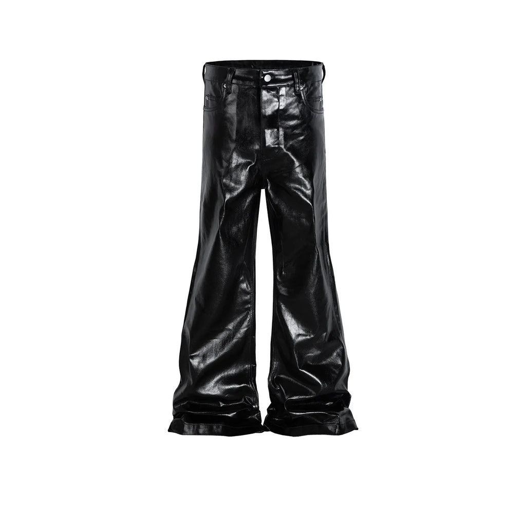 Black skinny jeans with a shiny patent leather coating and straight-leg cut on a denim background.