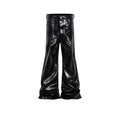 Black skinny jeans with a shiny patent leather coating and straight-leg cut on a denim background.