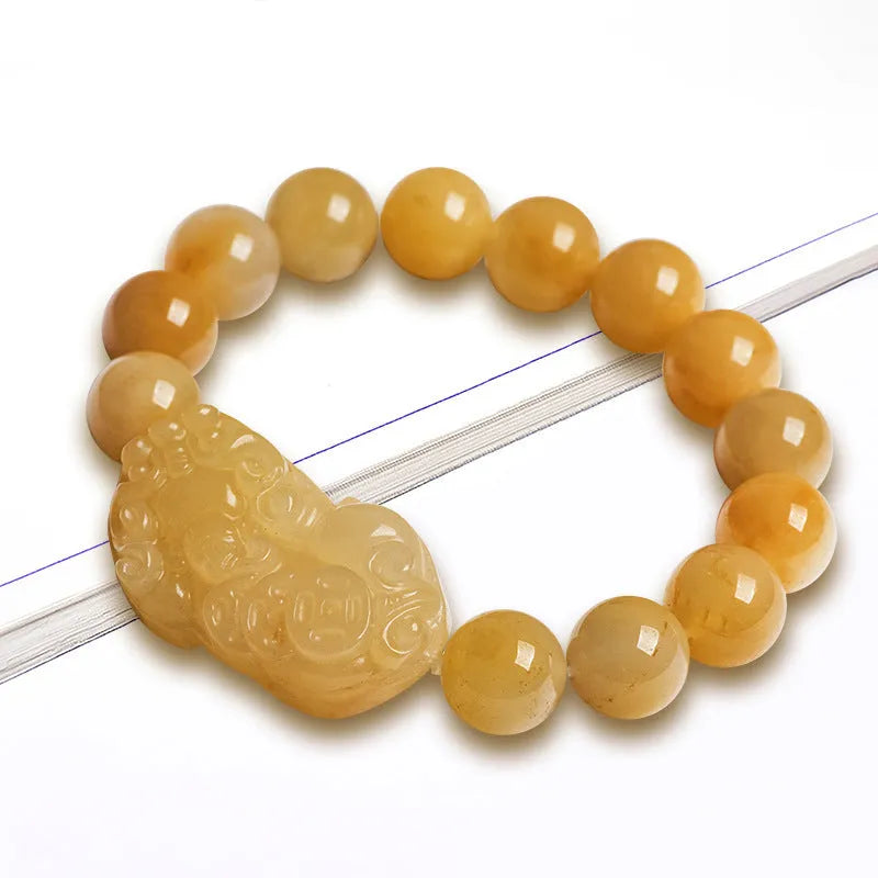 Jade money bracelet showing carved Jinsi Jade stone with beads in Golden Thread Jade colour
