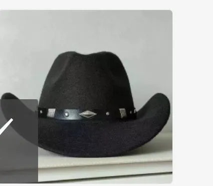 Brown leather velvet cowboy hat with a curved edge and conical crown on a plain background.