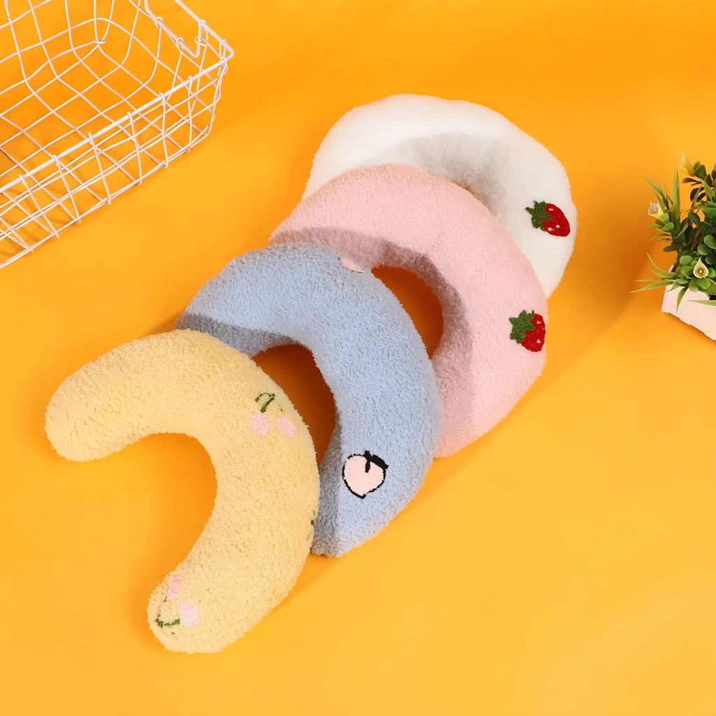 Half moon U-shaped cat pillow with cartoon dog and cat print in blue, pink, white, or yellow.