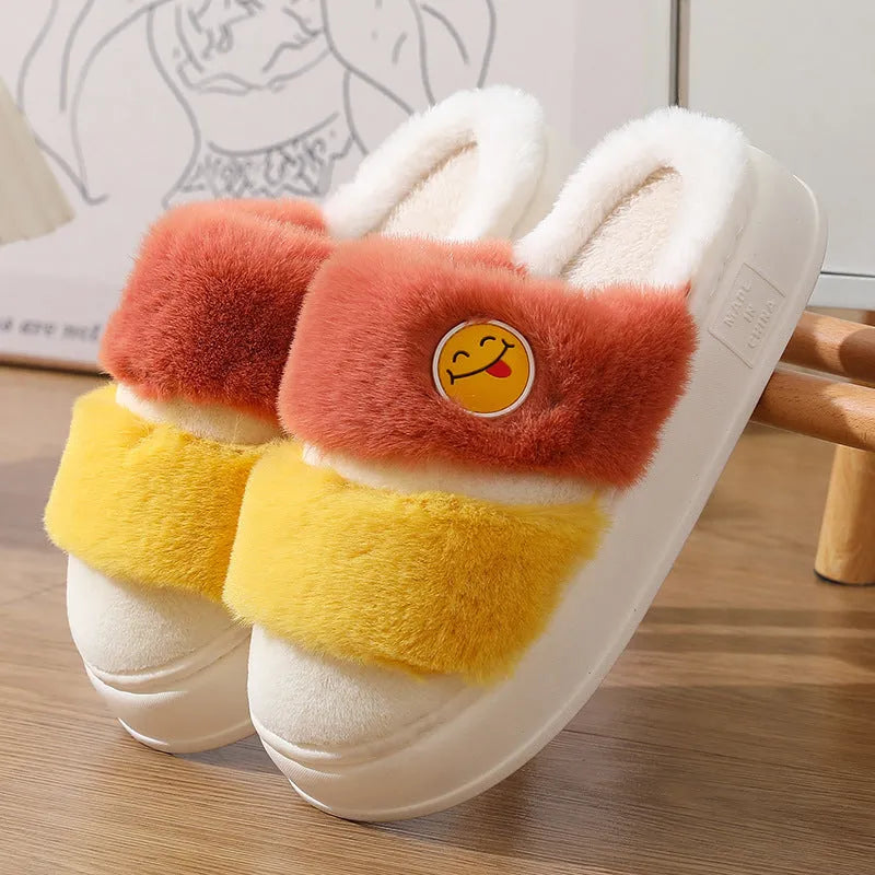 Pink and green thermal cotton slippers with plush upper and non-slip sole.