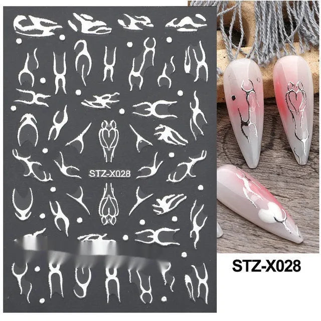 Plastic sheet of black, silver, and cartoon design nail art stickers for DIY manicures.