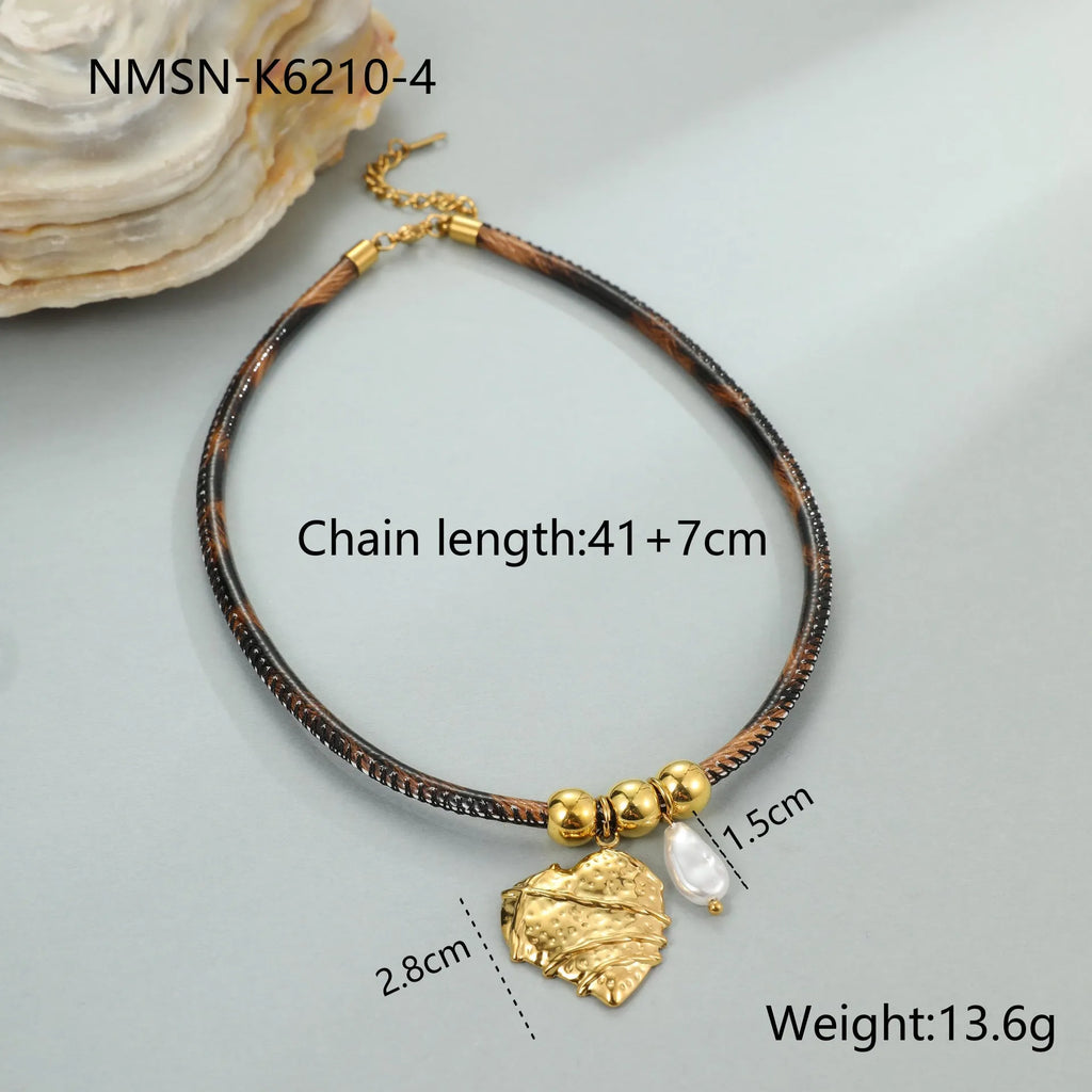 Geometric leopard print pendant on a gold-toned stainless steel necklace for women.