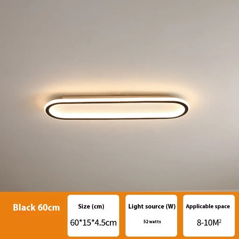 Minimalist black strip ceiling lamp with a linear PVC shade mounted on a white ceiling