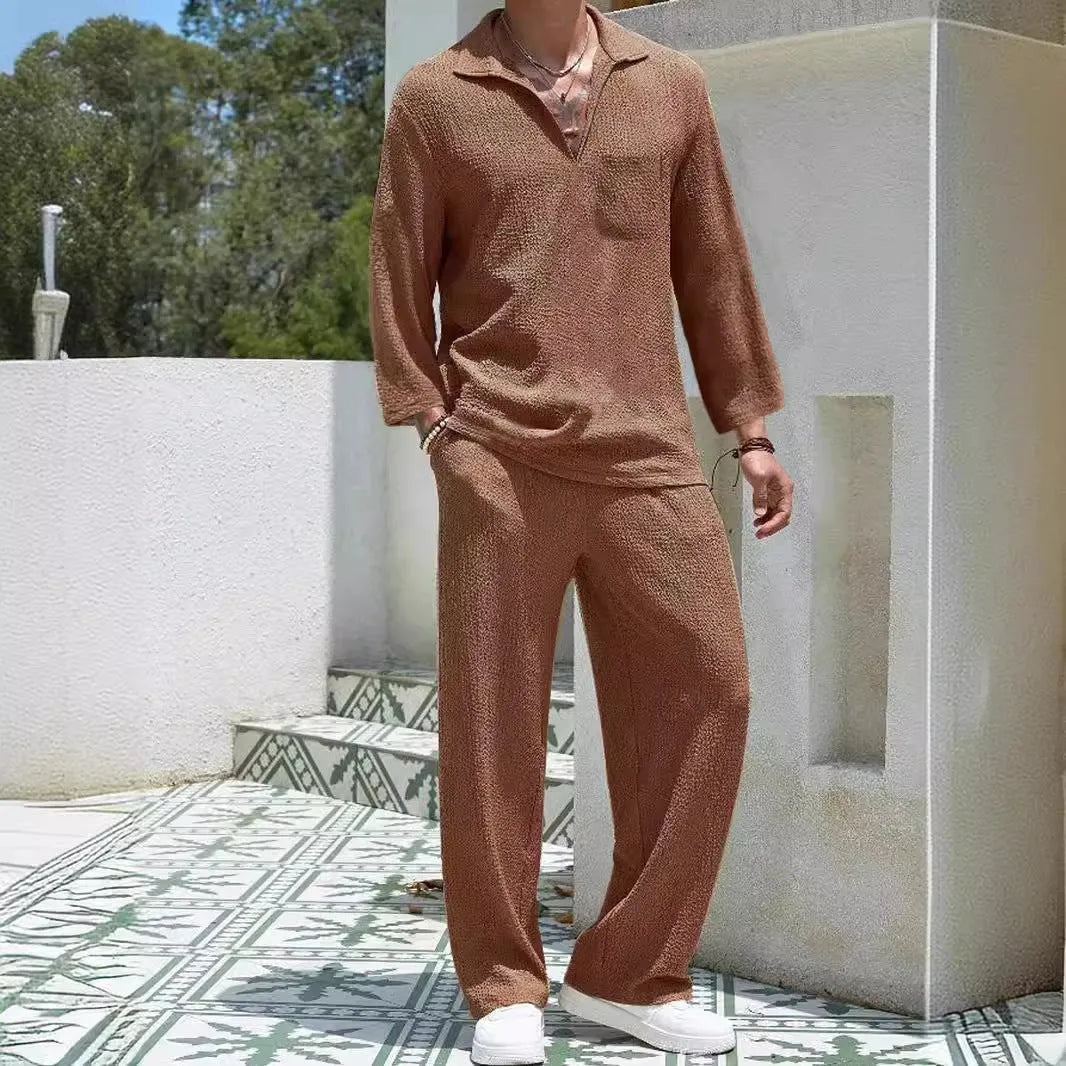 Man wearing a lake blue casual shirt and matching trousers from a polyester suit set.