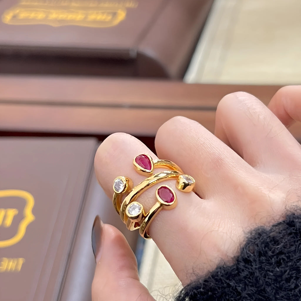 Geometric irregular-shaped ring with double-headed design and diamond accents in two-tone colours