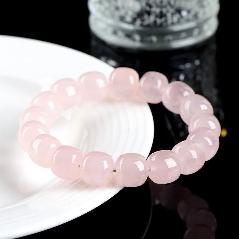 Pink bracelet with geometric barrel beads made from natural bamboo crystal measuring 11 * 12mm