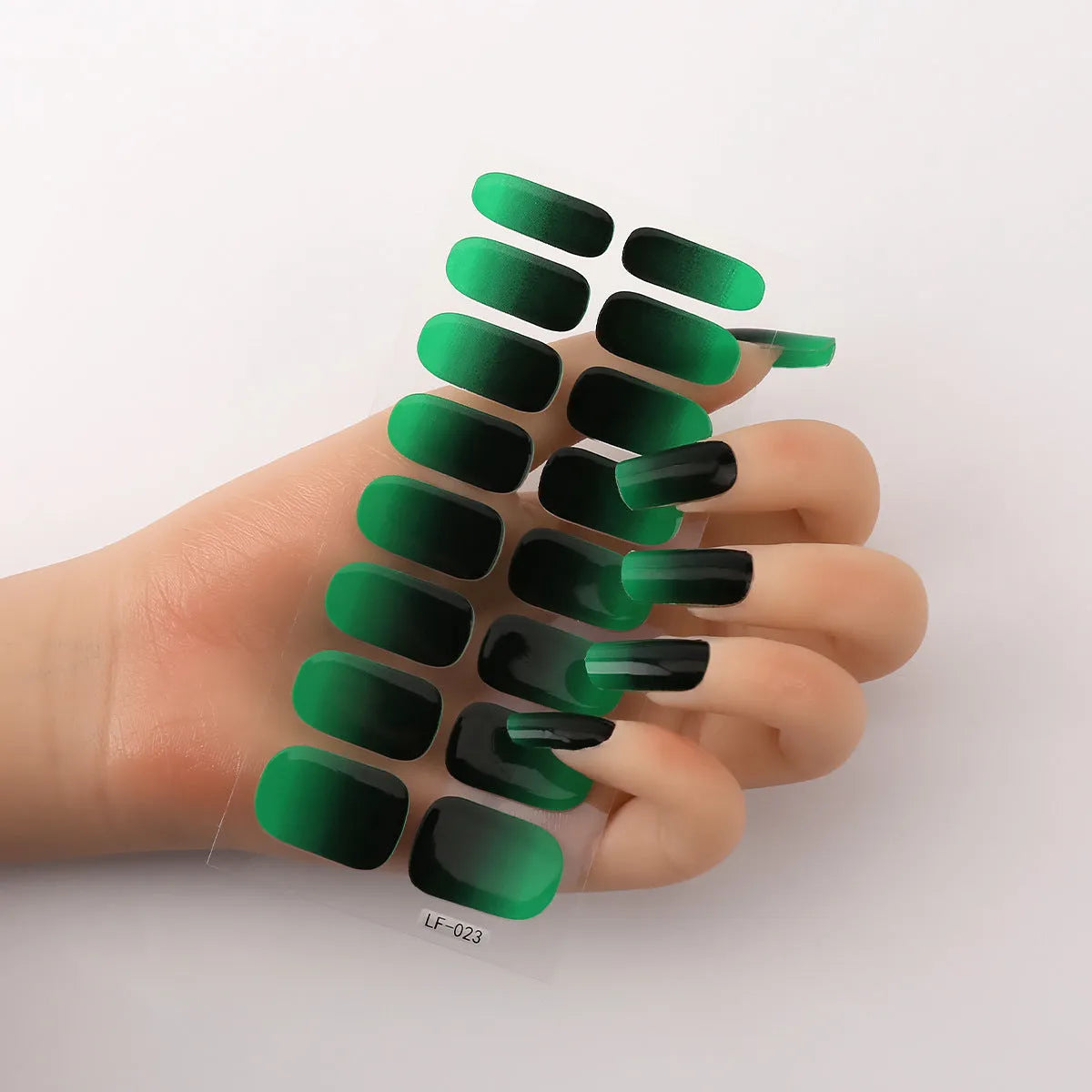 Full nail art sticker sheet showing 16 different solid colour designs including European simple nails and floral patterns