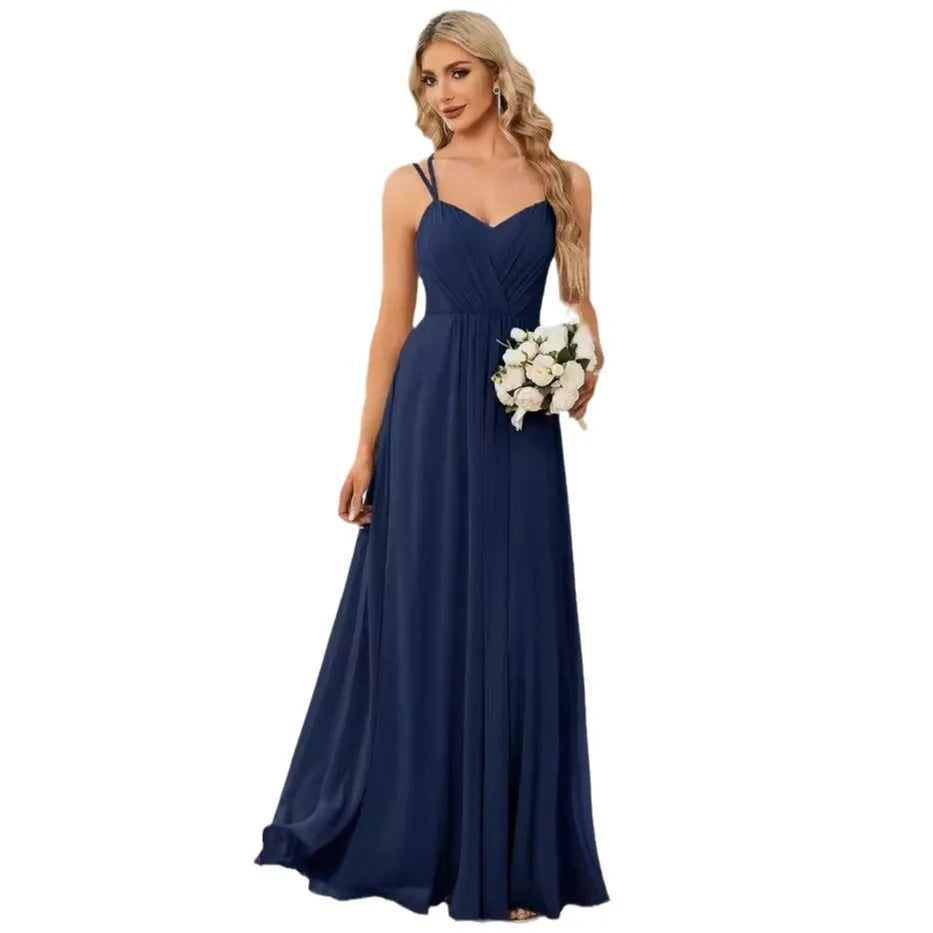 Women's light green sleeveless dress with sling neckline and long pleated A-line skirt.