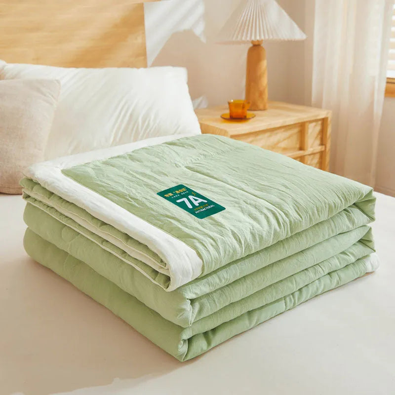 Antibacterial raw cotton washable summer cool quilt in Haze Blue colour, showing quilted pattern and fabric texture