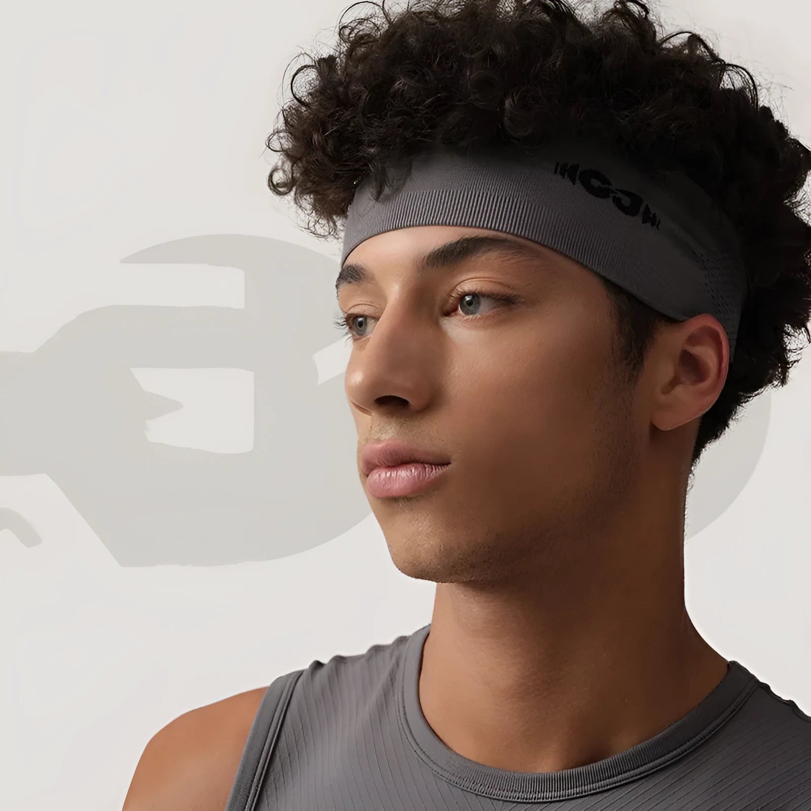 Classic black seamless knitted sports headband for men and women, laid flat.