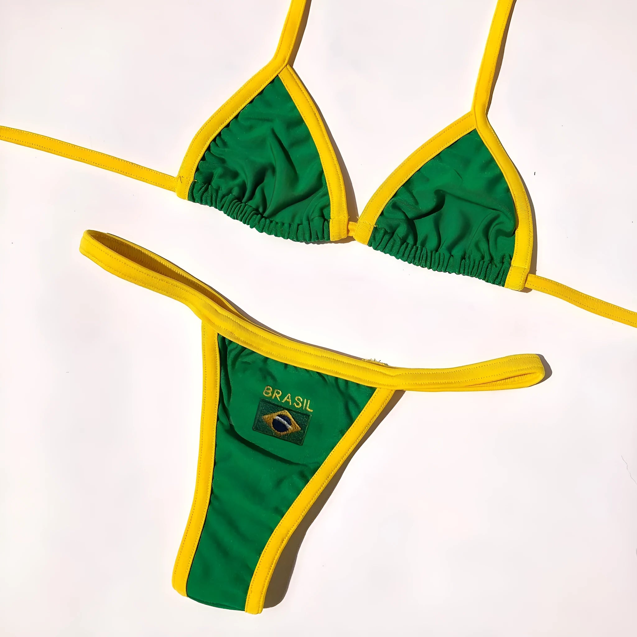 Yellow women's T-back bikini with sleeveless top and shorts-length bottoms on a mannequin