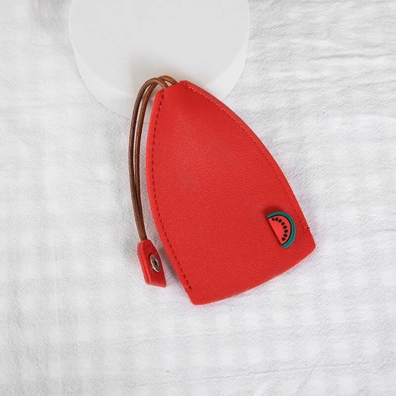 Cartoon pull-out key case in PU leather showing design options including resin fruit and big cartoon animal prints.