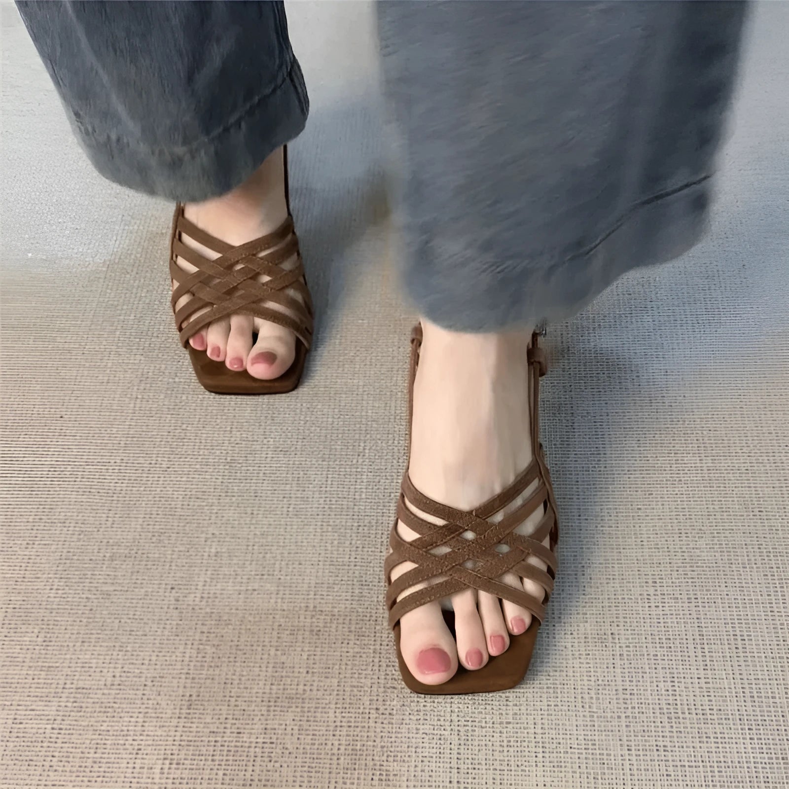 Women's light brown retro sandals with crossed straps, square toe, mid-heel, and ankle buckle on a white background.