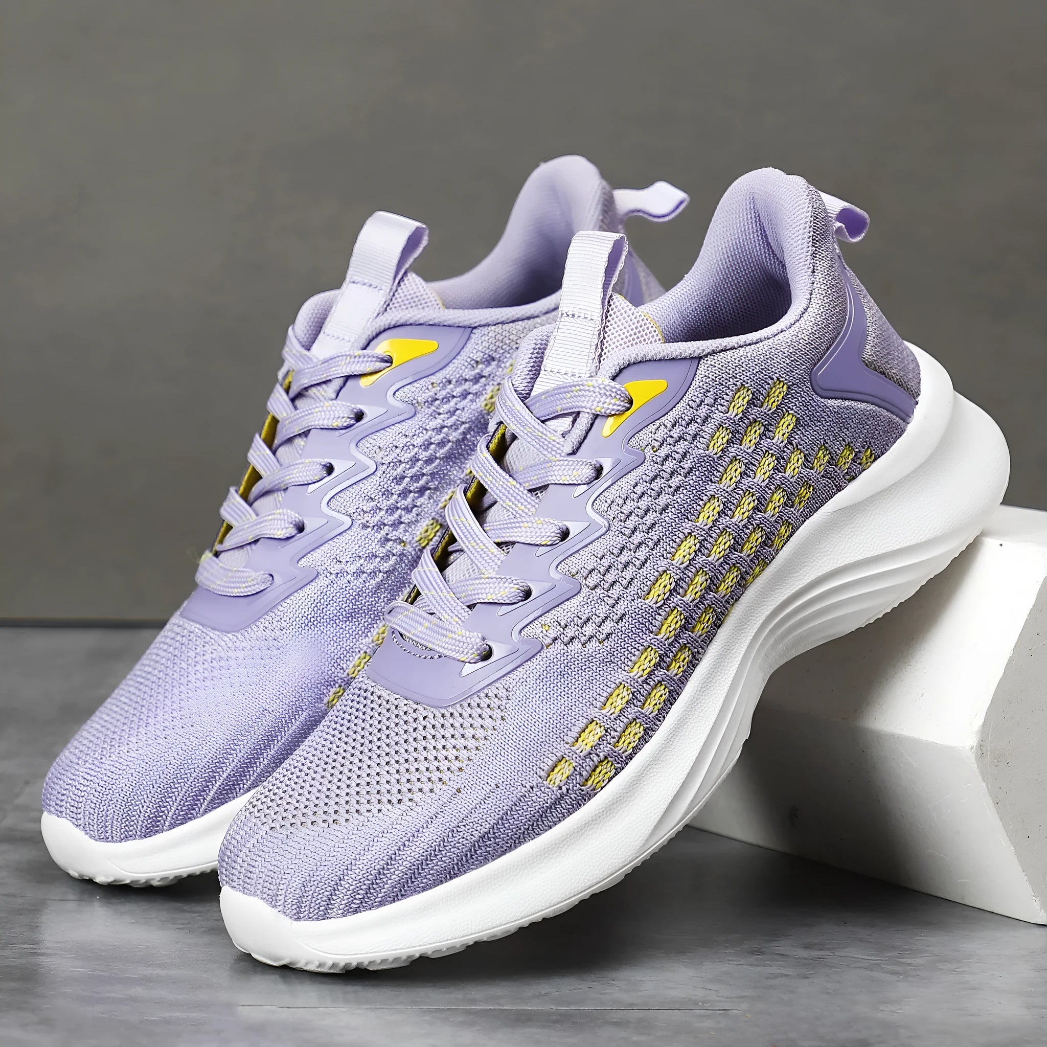 Women's lavender purple Flyknit running shoes with mesh fabric and striped pattern