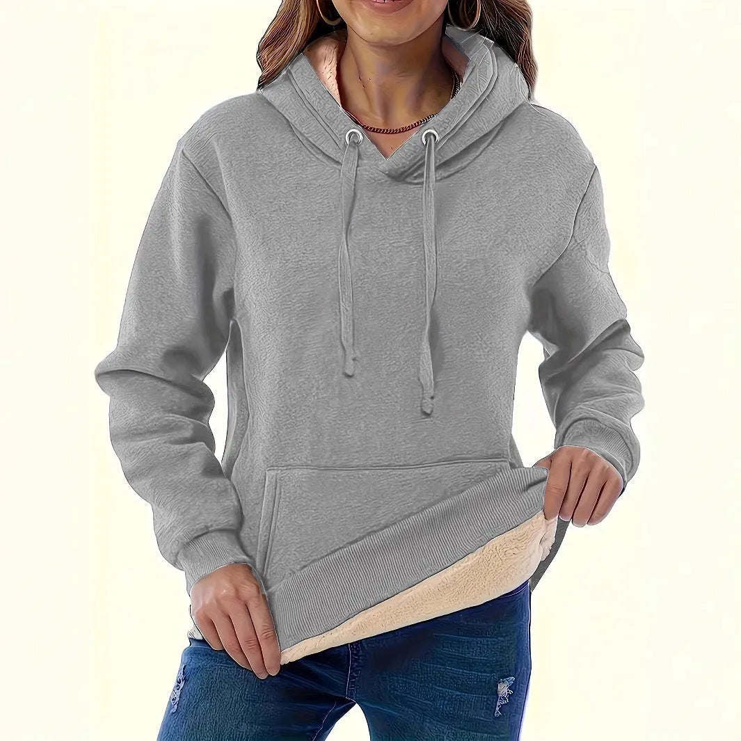 Women's loose grey hooded sweater with a 3D textured pattern on the front.