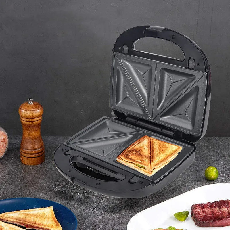 Black electric sandwich toaster with double-sided heating and six non-stick plates on a countertop.