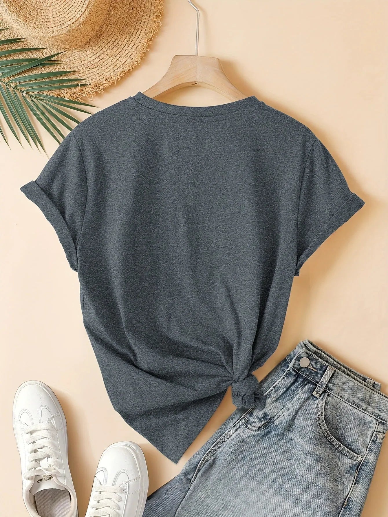 Women's art retro style printed cotton short sleeve T-shirt on a hanger.
