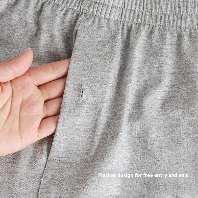Men's solid-colour cotton boxer shorts with a high-waist, loose fit on a neutral background.