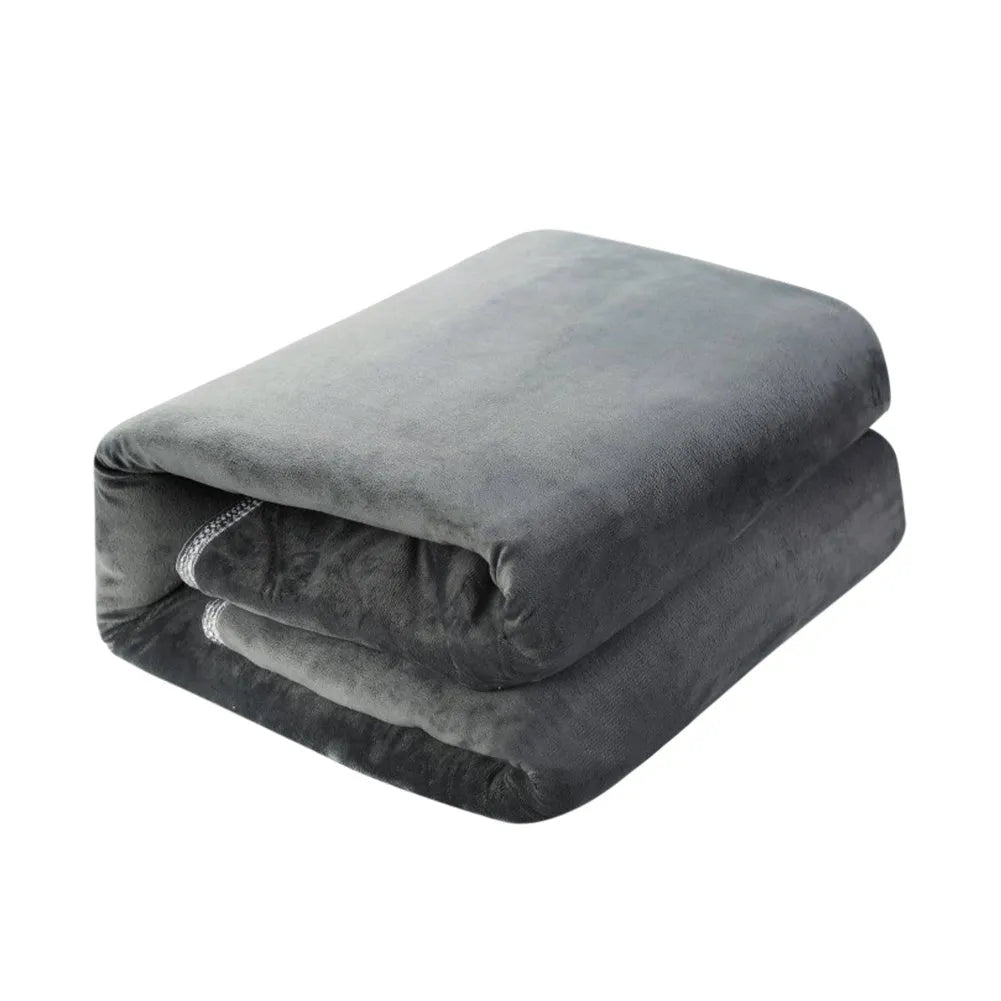 Grey tweed electric heating blanket on a bed, showing simple solid colour design