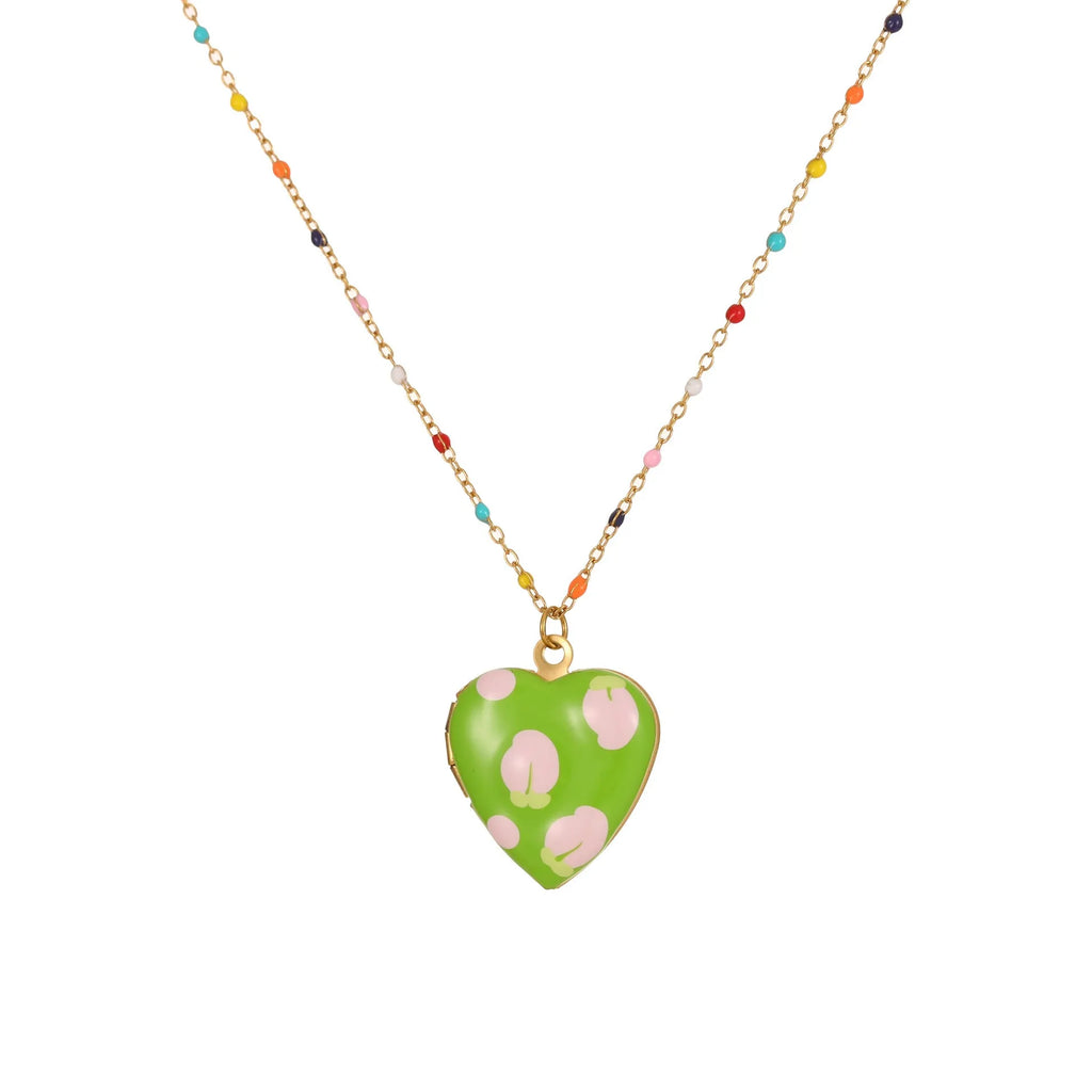 Stainless steel fruit pendant necklace with gold plating showing heart and fruit charm designs on adjustable chain