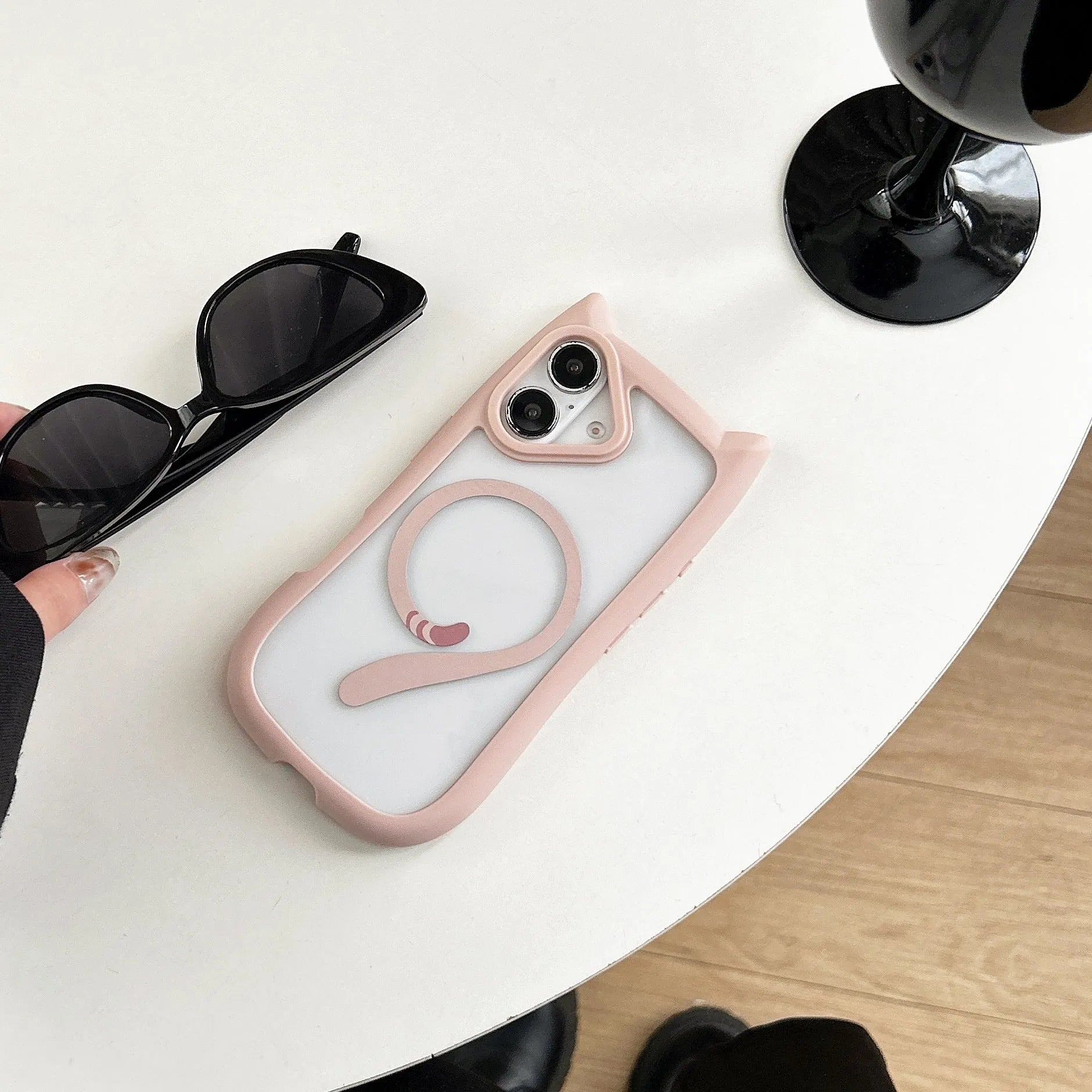 Clear acrylic and TPU two-layer phone case for iPhone 17 models on a table