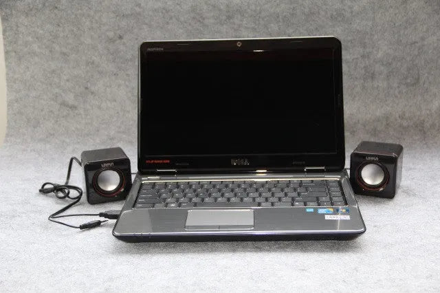 Small black square computer speaker with USB cable for PC connection