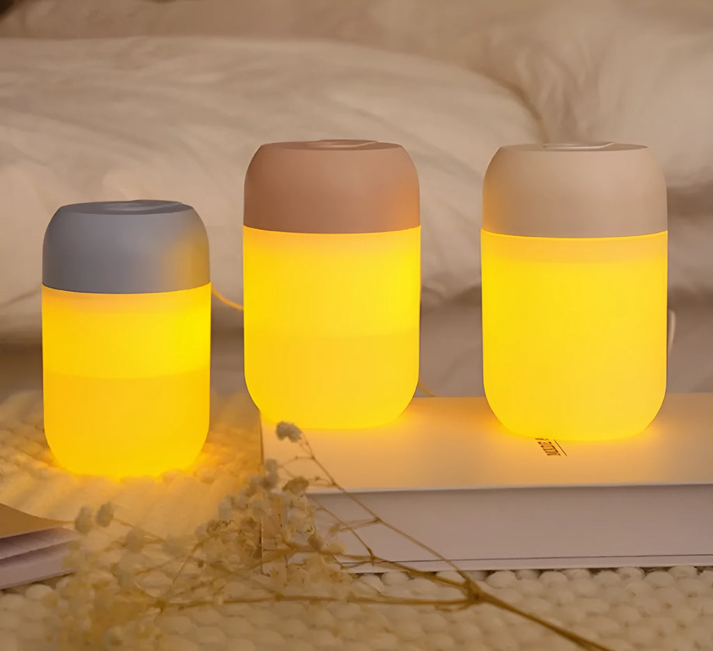 White cylindrical mini humidifier with USB cable for small room aromatherapy and humidification