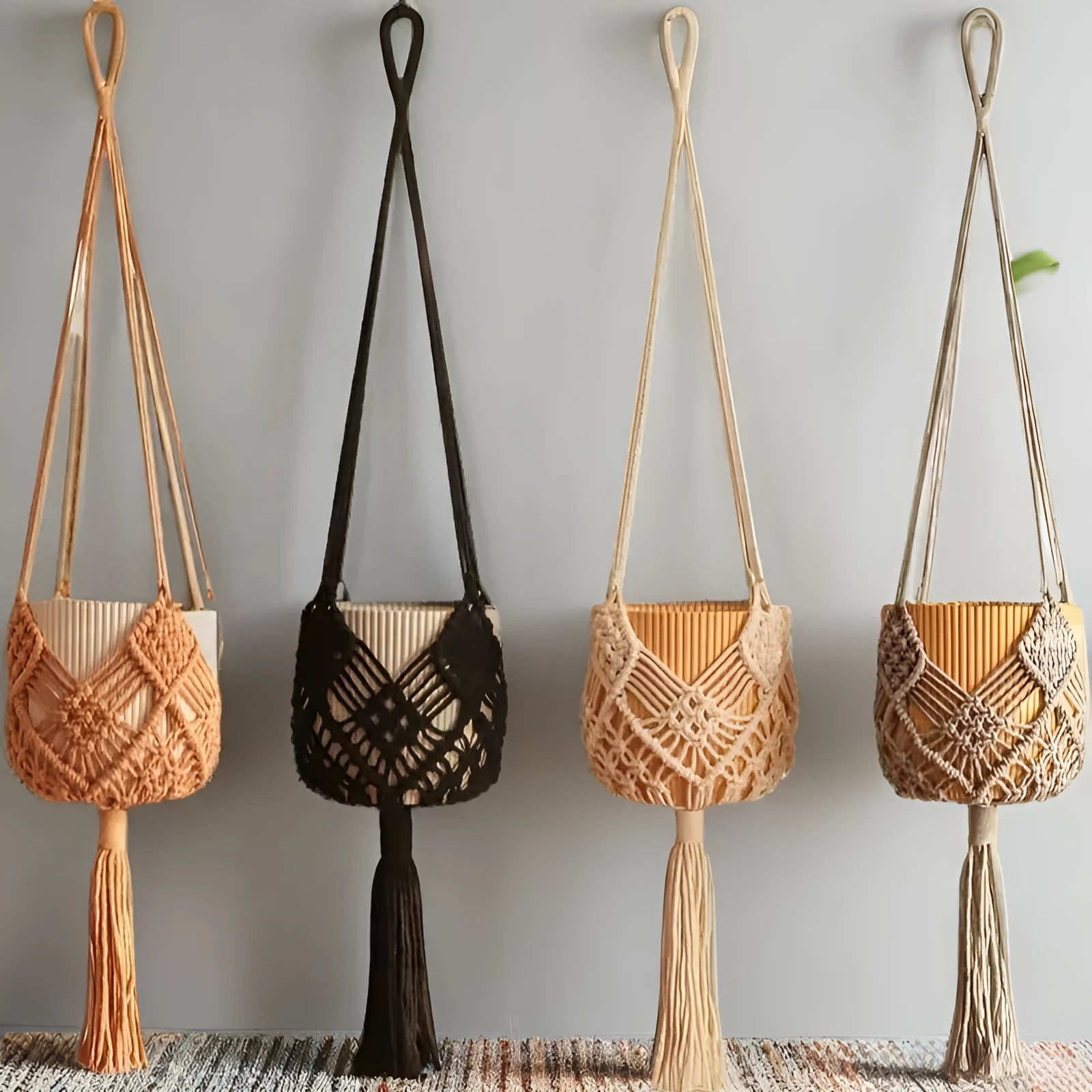 Handwoven brown polyester cotton flower pot net sleeve covering a plant pot.