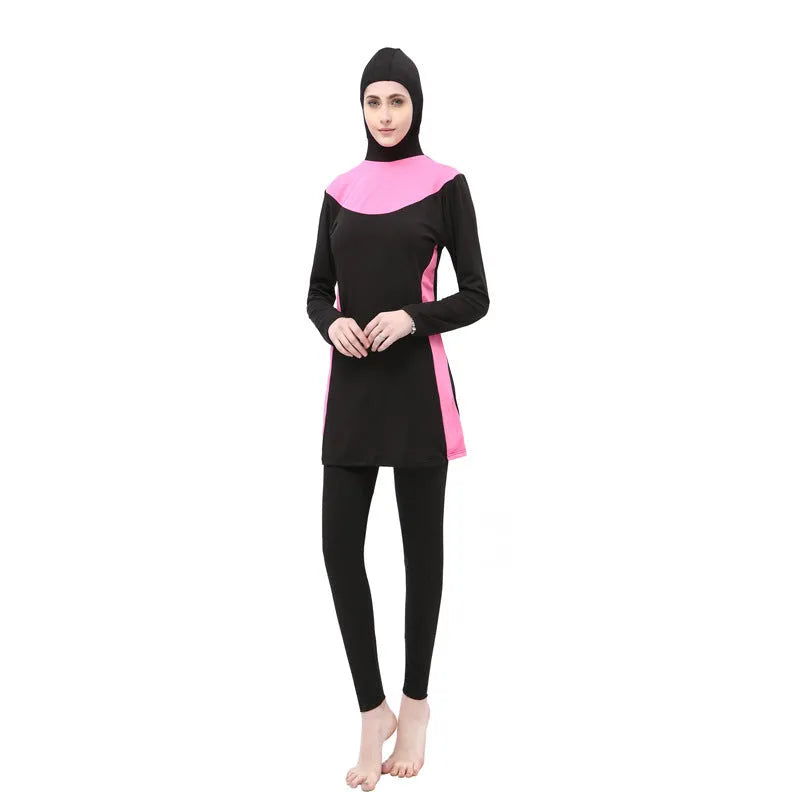 Conservative black women's swimsuit with hood, long sleeves, and full-length pants in a two-piece set.