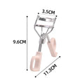 SUNFLOWER pink eyelash curler with chrome scissors handle on a white background.