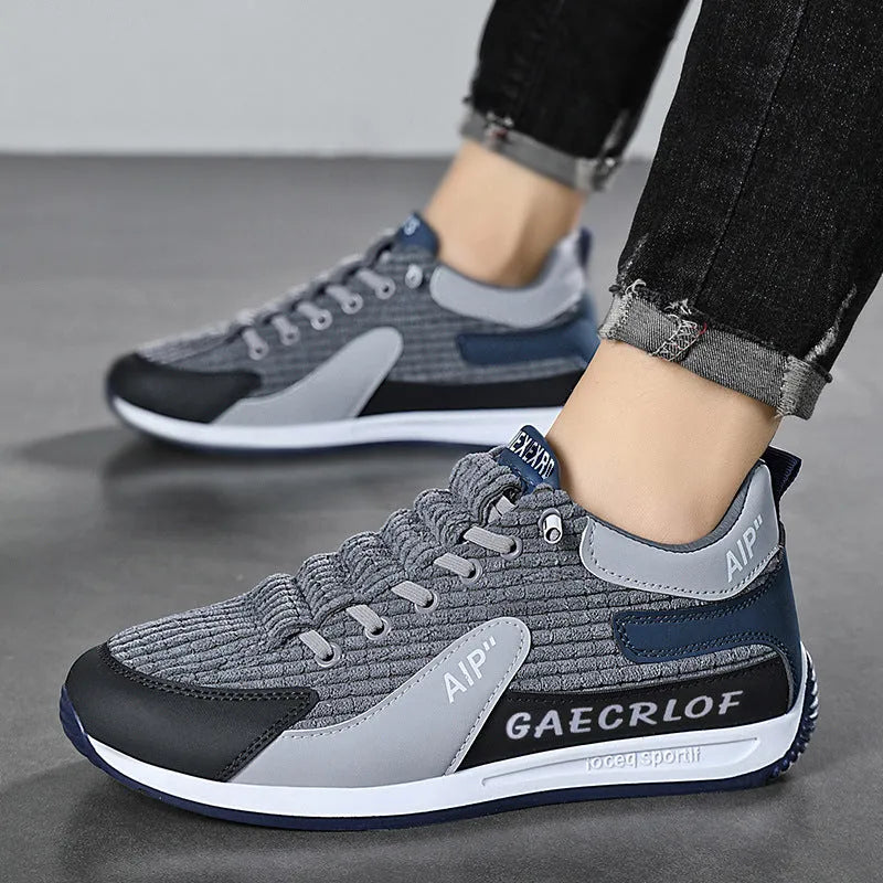 Men's grey and green mesh running shoes with round toe and lace-up front