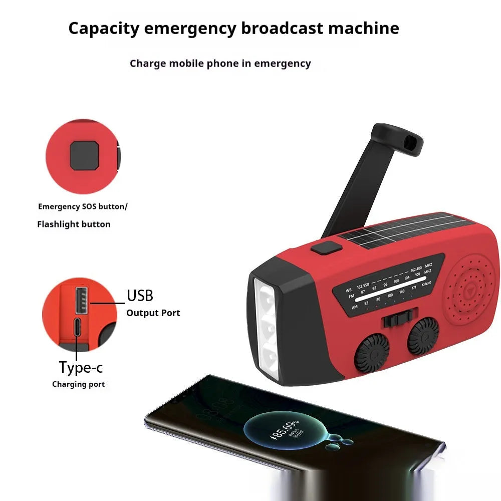 Red rechargeable emergency hand radio and LED torch with wrist strap on a white background