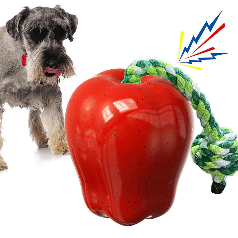 Green or red plastic apple-shaped dog dropping ball toy with hollow treat compartment