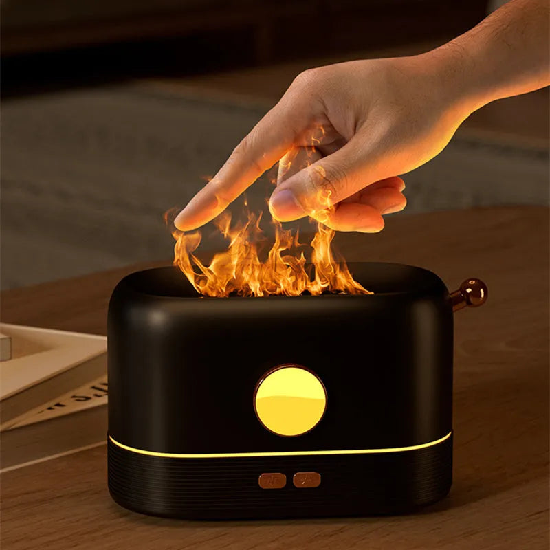 Black USB desktop humidifier with simulation flame light effect and water vapour mist.