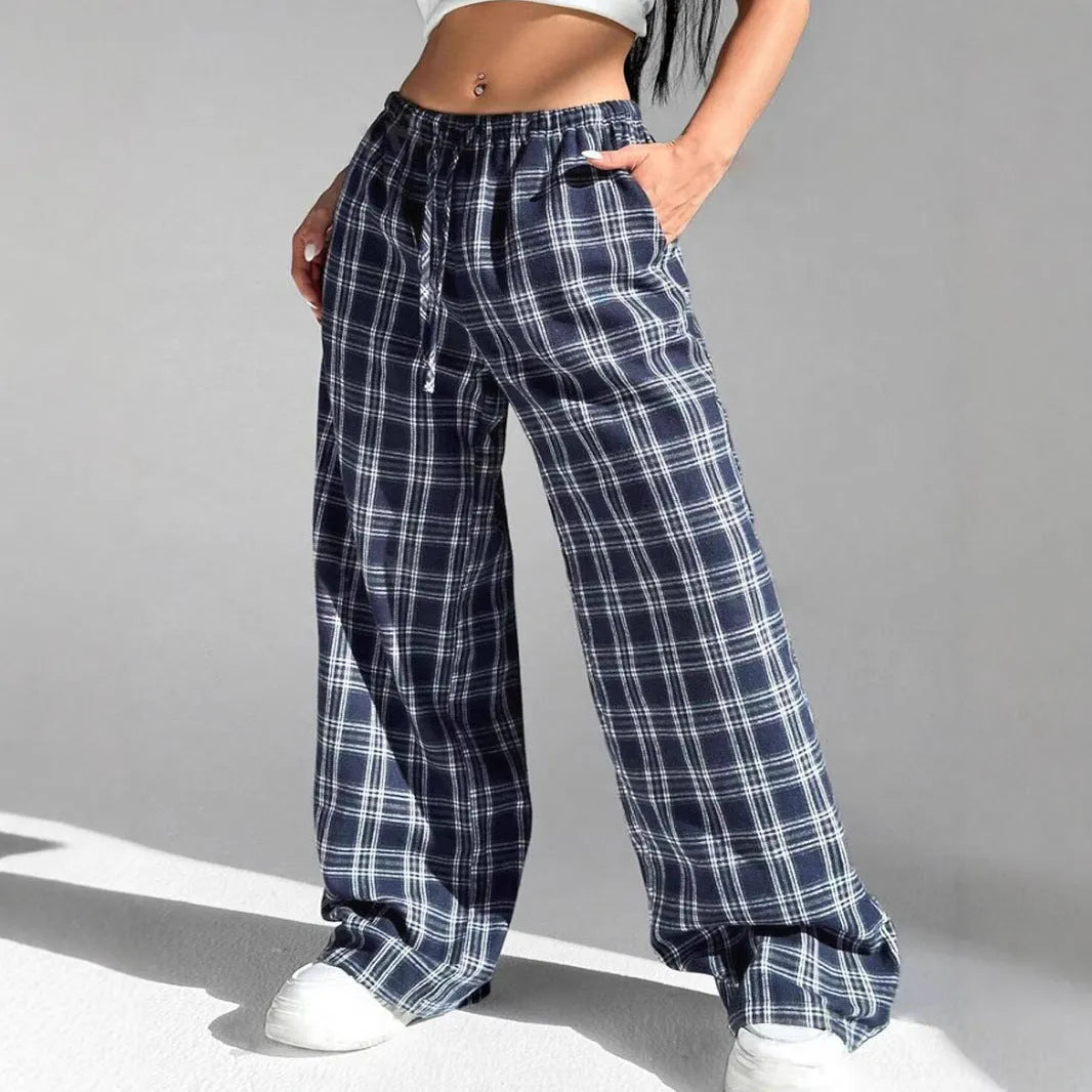 Women's red plaid loose trousers with drawstring waist and side pockets laid flat