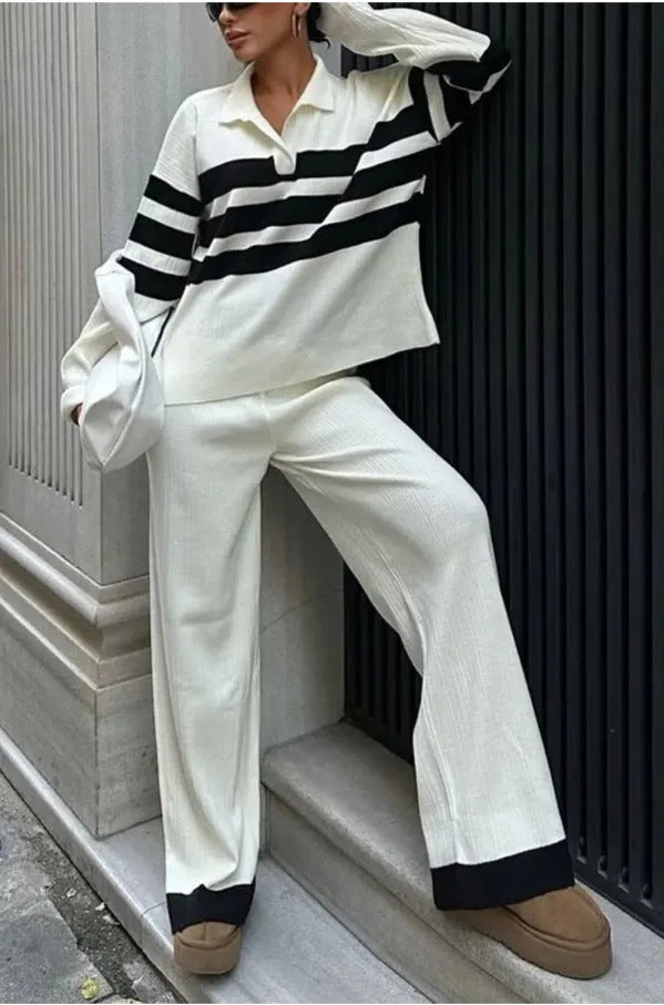 Women's black and white striped knitted two-piece set with polo collar top and matching trousers