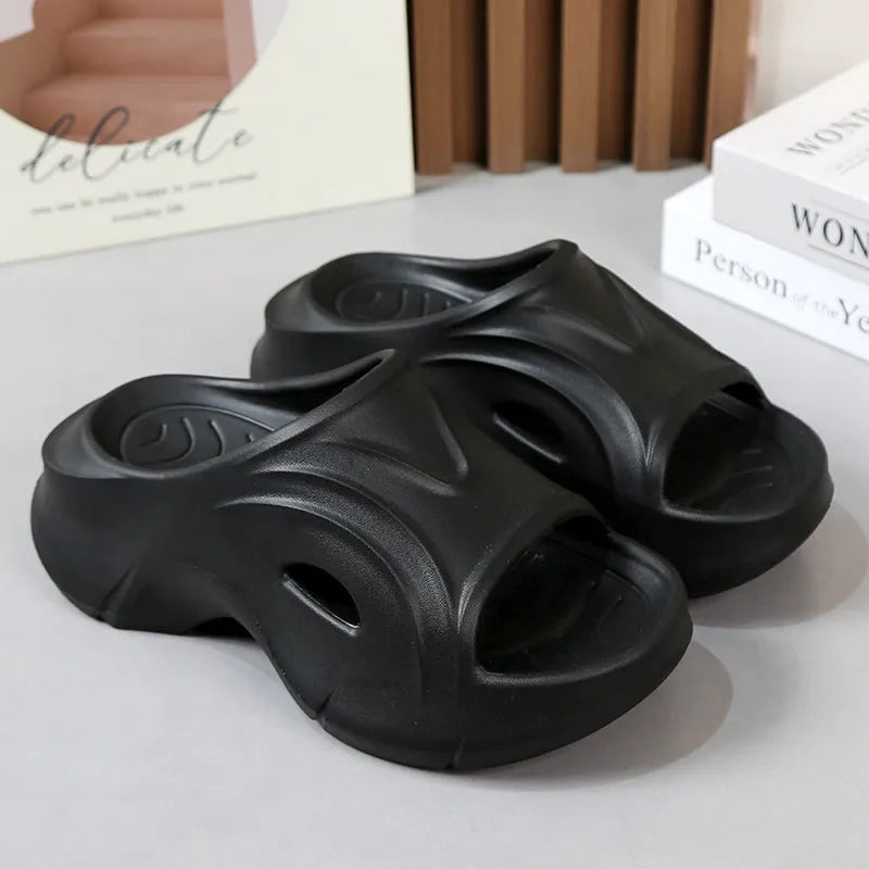 Women's white EVA slippers with thick sole and round toe on a beach background
