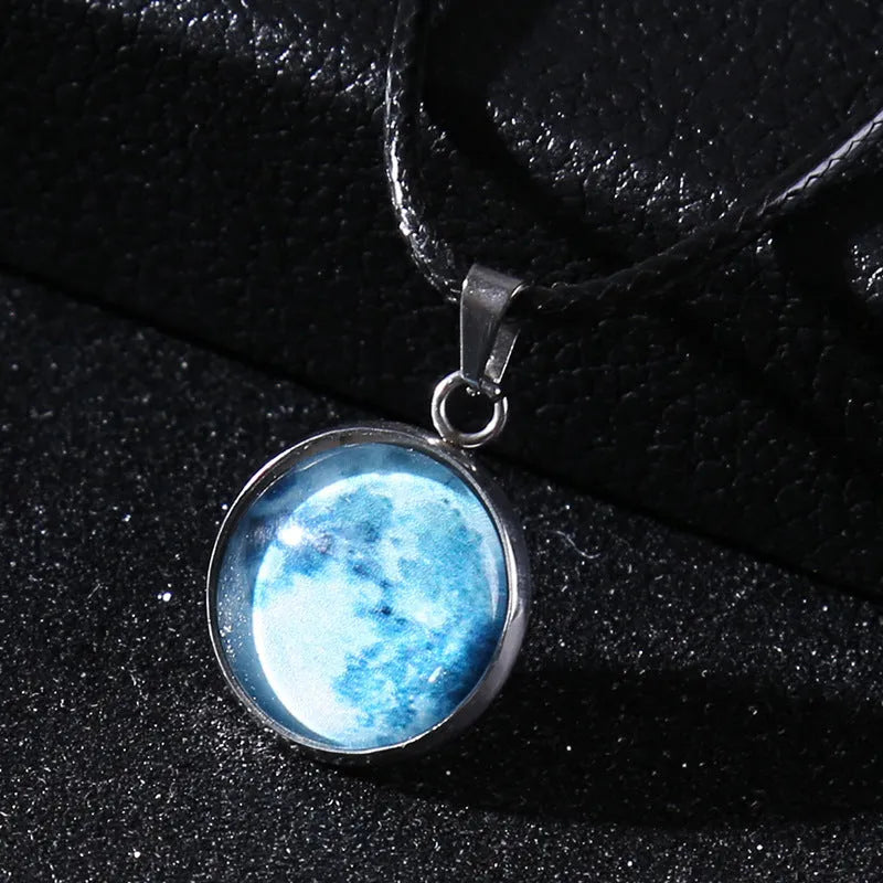 Luminous moon and constellation design pendant on an alloy necklace chain with extension.