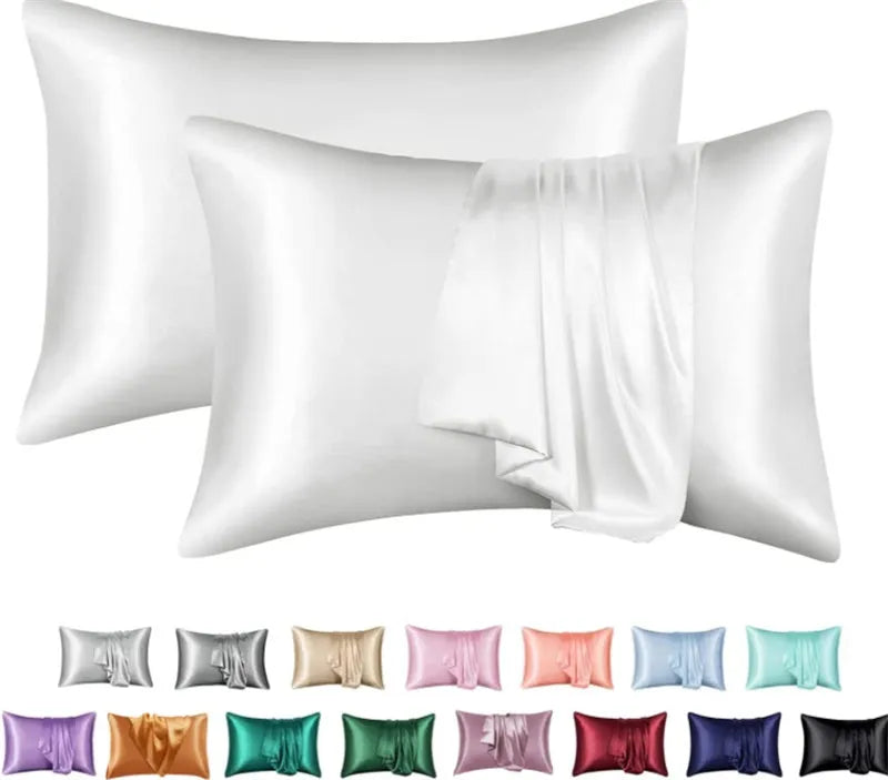 Dark blue polyester satin pillowcase with envelope closure on a bed with white sheets
